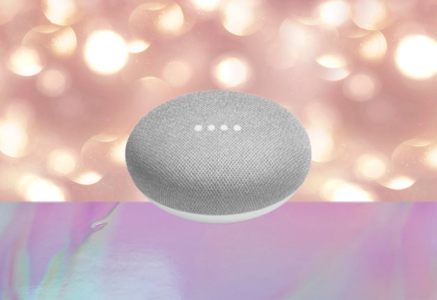 A grey google nest mini on a sparkle backdrop