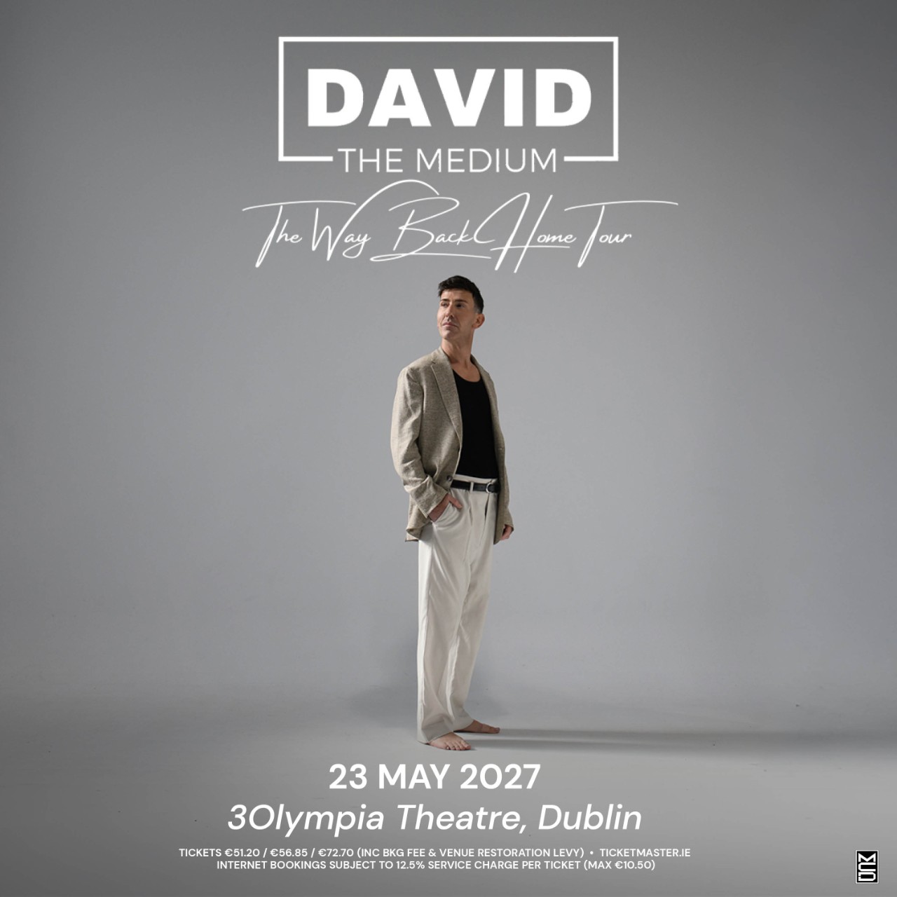 Promotional poster for "David The Medium: Coming Home: Reunion Tour" featuring David seated barefoot in a white armchair looking upward, scheduled for May 23, 2027, at the 3Olympia Theatre in Dublin.