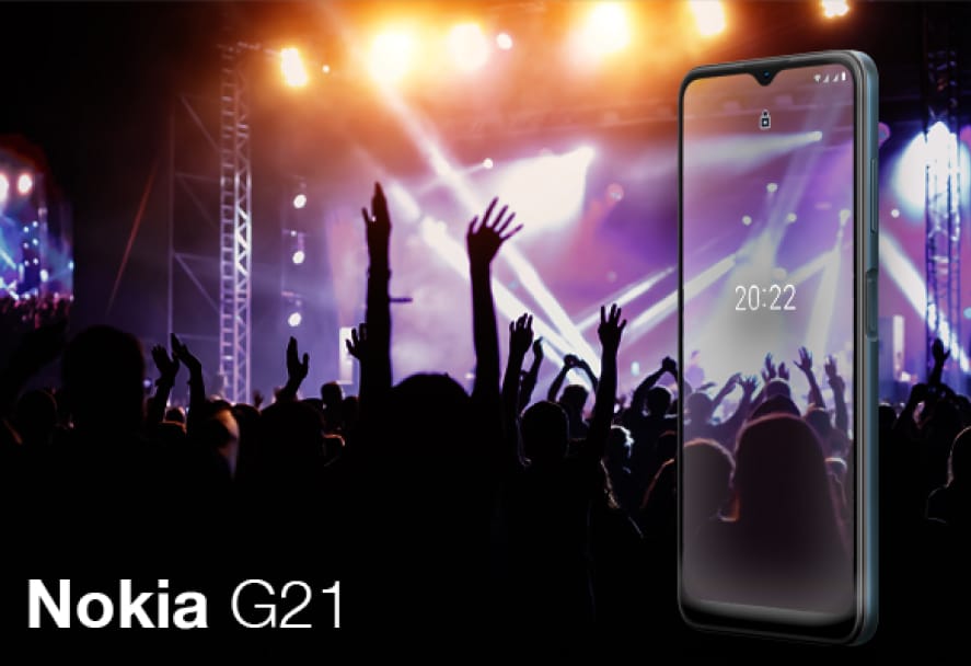 A Nokia G21 smartphone displaying a live concert scene on its screen, with a crowd of raised hands and bright stage lights, showcasing the phone's vivid display quality.