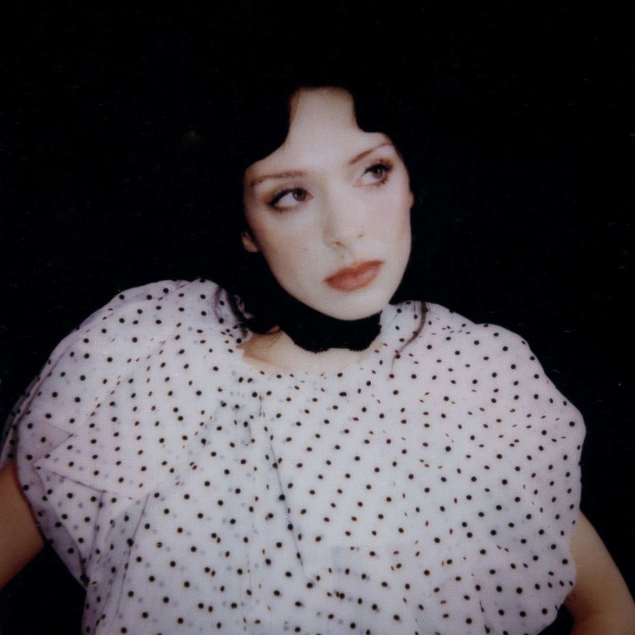 Holly Humberstone posing in a polka dot top.
