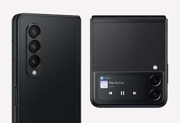 Close-up of the Samsung Galaxy Z Fold3's triple rear camera system alongside the Z Flip3's cover screen displaying music playback controls, both in Phantom Black.