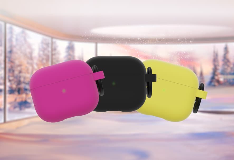 A pink, black and yellow silicone AirPods cases on a festive backdrop