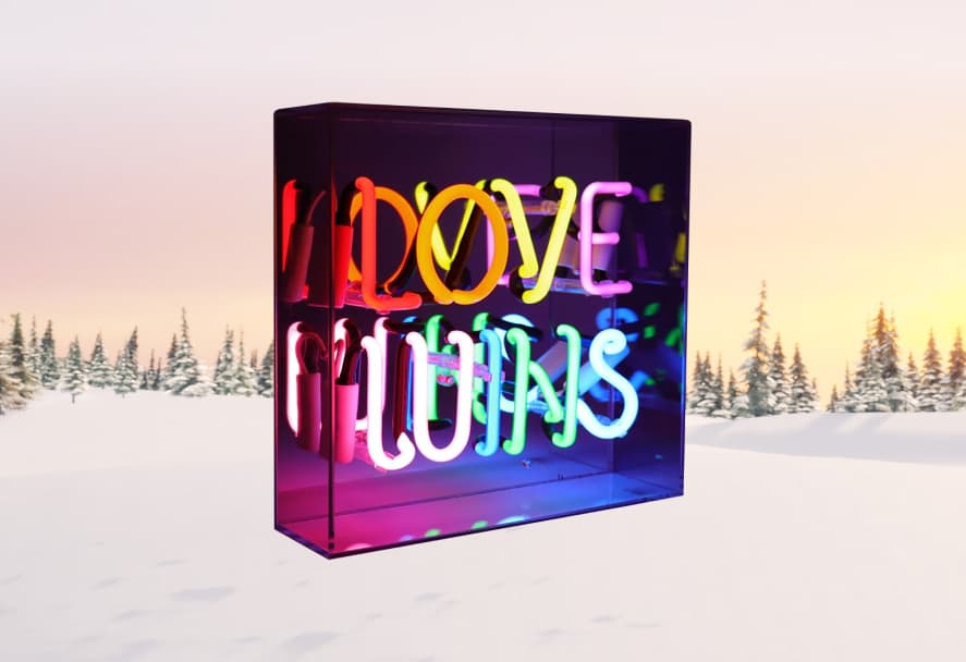 A colorful neon sign on a snowy mountain backdrop