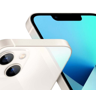 A closeup of two white iphone 13's. A closeup of two white iphone 13's.