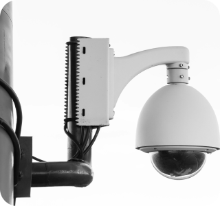 Image of a security camera mounted on a pole Image of a security camera mounted on a pole