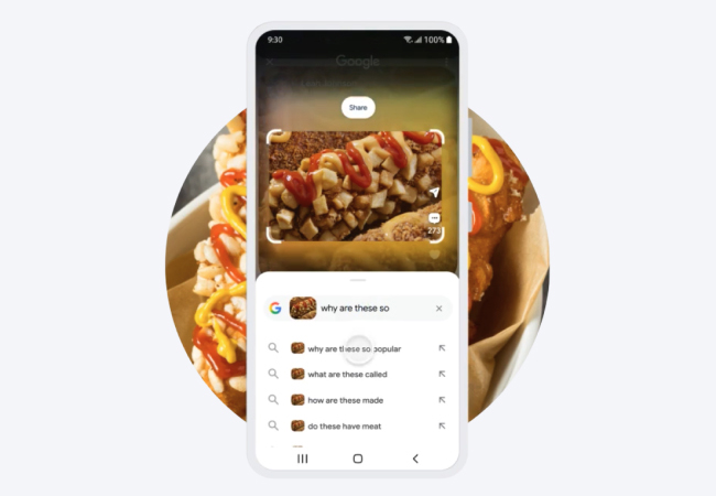 A smartphone using Google Circle to Search on an image of a potato-coated Korean corn dog, displaying search queries like "why are these so popular" and "what are these called".