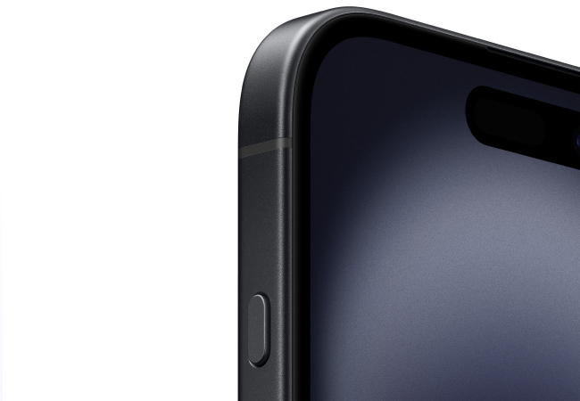  A close-up shot of the top left corner of a dark-colored smartphone, featuring its rounded edges and screen.