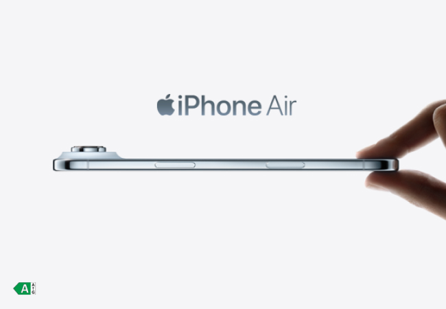 A person's fingers hold the very thin, silver iPhone Air from the side. The phone is shown in profile, highlighting its slender design. The camera module on the back protrudes significantly. The Apple logo and "iPhone Air" text show above the phone