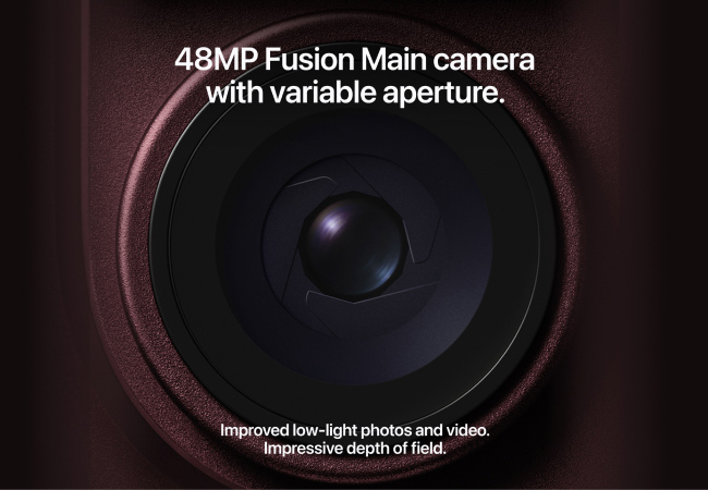 A close-up view of a dark red iPhone 18 Pro camera lens showing visible mechanical aperture blades, accompanied by text detailing its 48MP variable aperture feature.