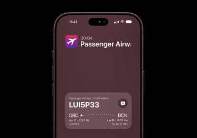 A close-up view of a deep burgundy iPhone 18 Pro screen displaying a Live Activity flight status widget and an airline notification card.