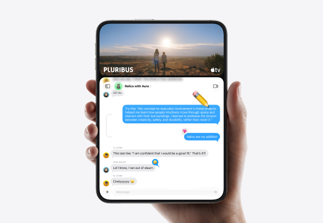 A hand holding an unfolded iPhone Duo in portrait orientation running split-screen multitasking with Apple TV playing "PLURIBUS" on the top screen and a Messages conversation on the bottom screen.