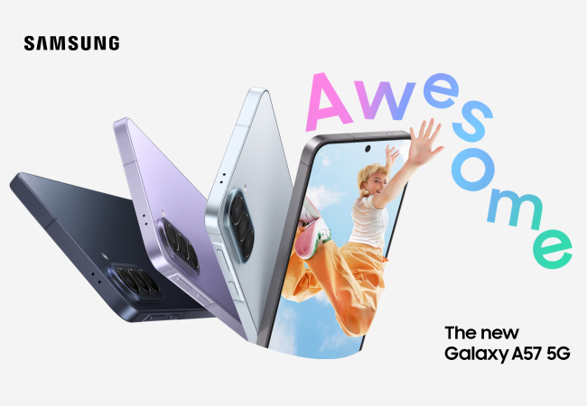 Four Samsung Galaxy A57 5G phones fan out in dark grey, lavender, and light blue. The front phone displays a person jumping beneath the word "Awesome" in large, colorful gradient text. The Samsung logo and model name are positioned in the corners.