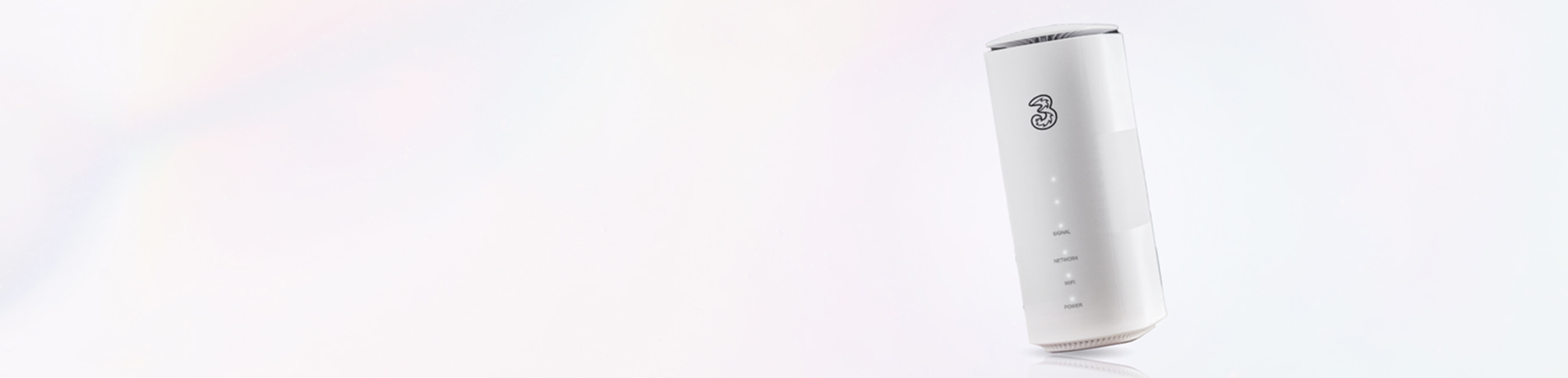 A white Three 5G Broadband Hub angled slightly to the left, appearing to float against a clean, bright white background. The router’s "3" logo and vertical status lights—Signal, Network, WiFi, and Power—are clearly visible, with a faint reflection on the surface below.