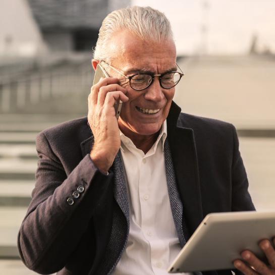 business_man_on_phone_with_ipad