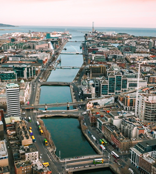 Aerial view of Dublin City with the river Liffey cutting through the centre and flowing into the sea