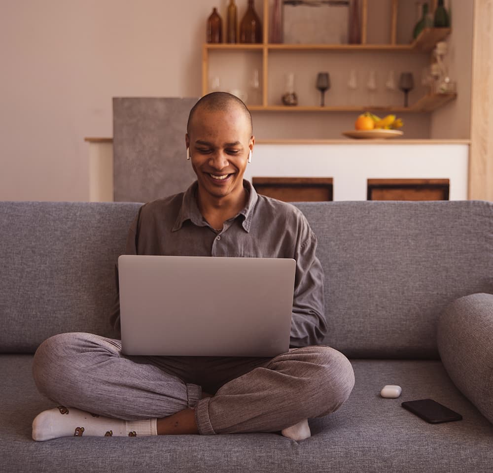 Person shopping online on couch using wifi
