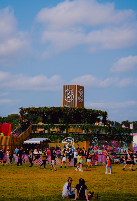 Three-branded Electric Picnic stage surrounded by festival-goers and greenery.