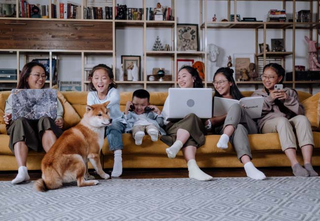 A family using multiple devices, enjoying high spreed broadband.