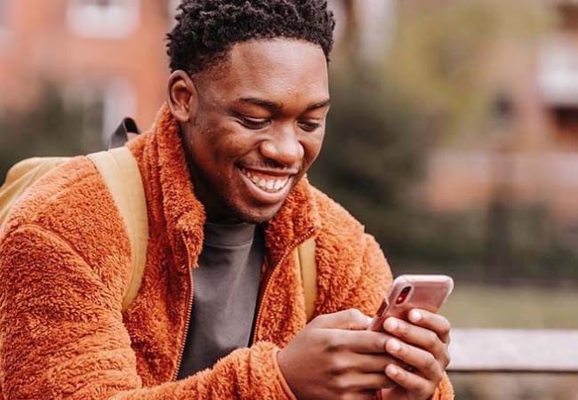 A man using his phone abroad.