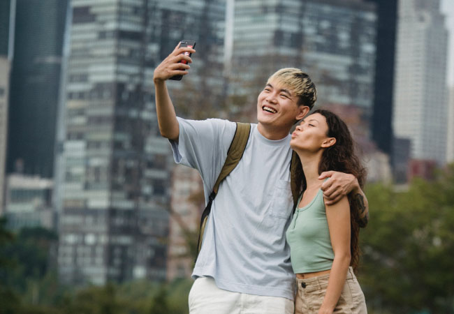 A couple taking a selfie abroad.